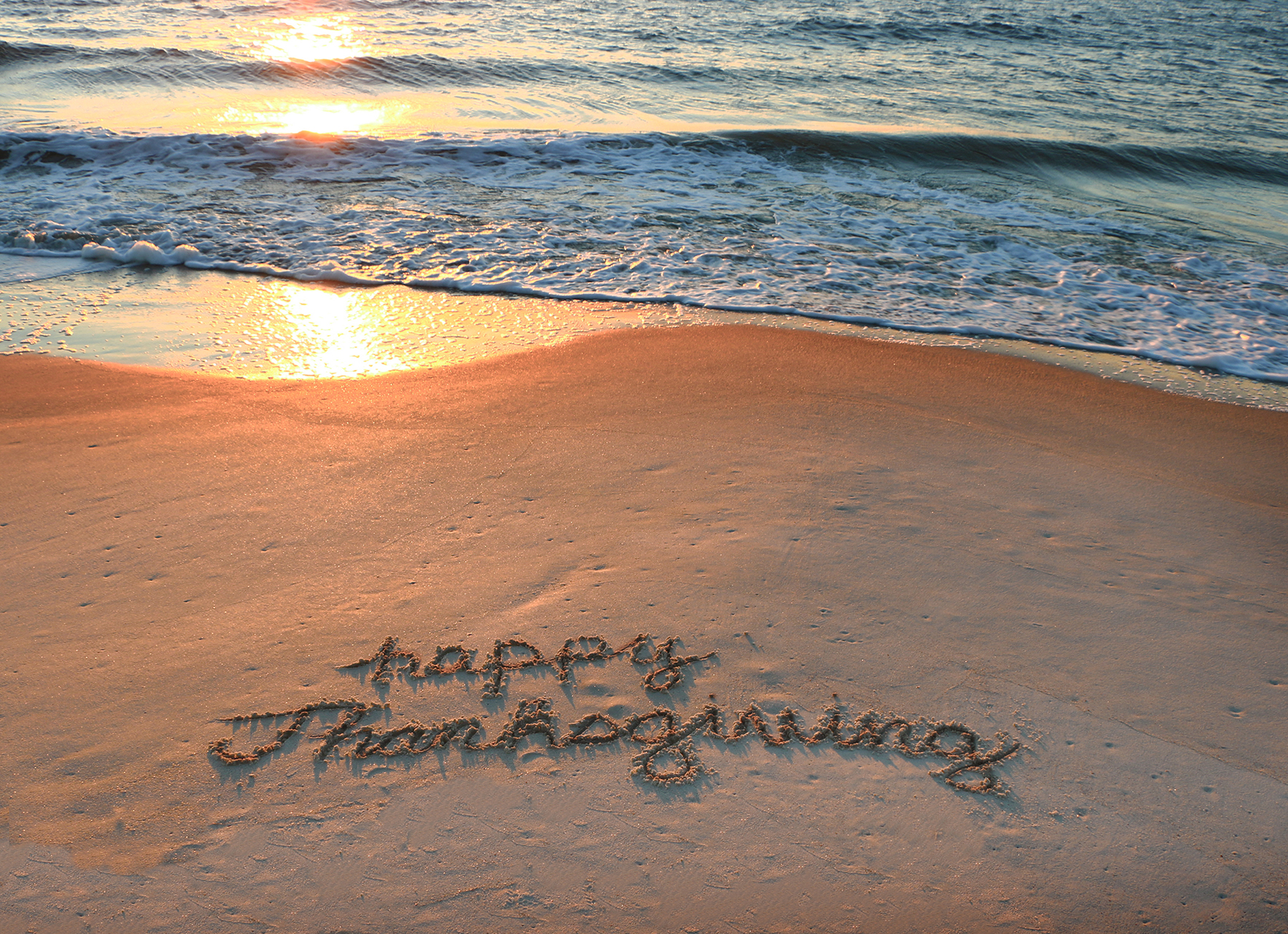 a text written in sand on a beach