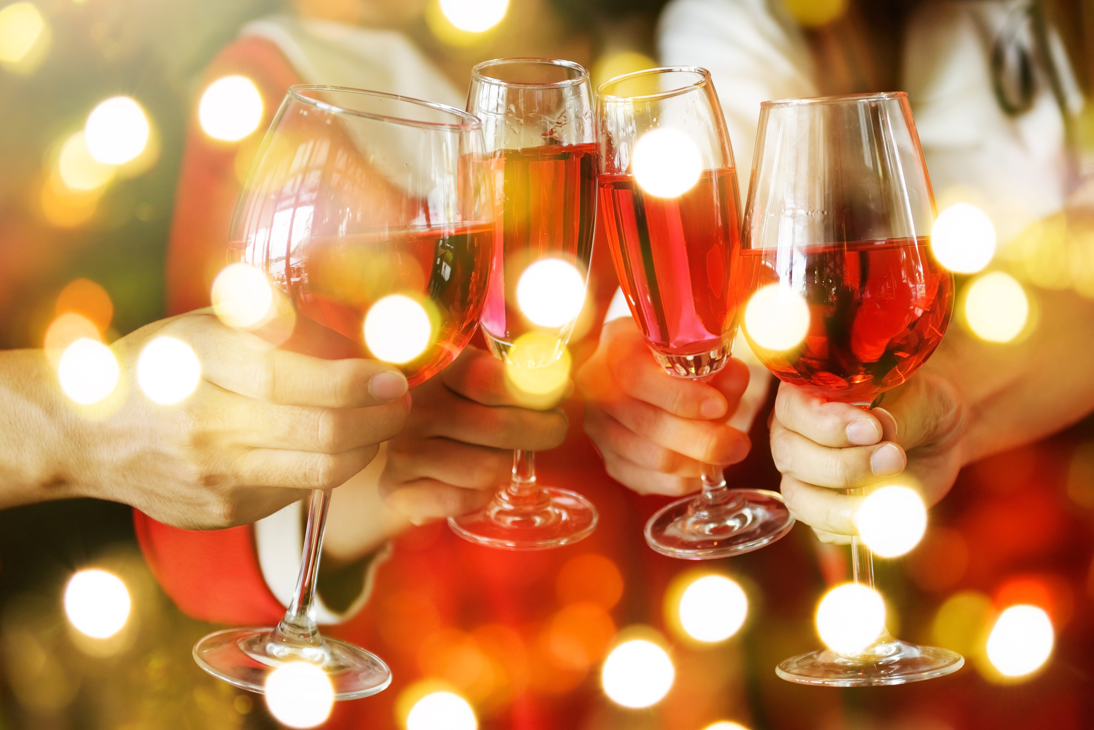 a group of people holding wine glasses